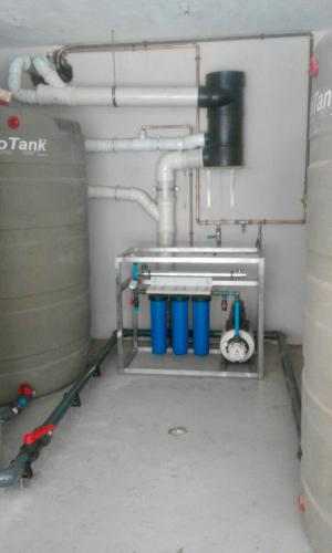 Integrated potable rainwater harvesting treatment system